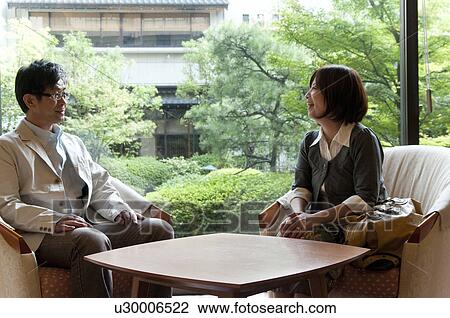 Mature Couple Talking in Hotel Lobby View Large Photo Image Stock Image - Mature Couple Talking in Hotel Lobby. Fotosearch