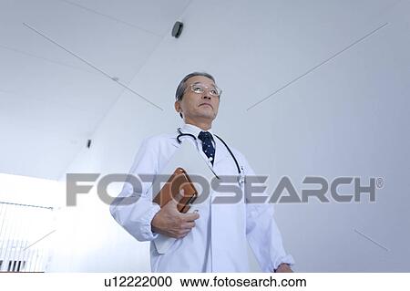 Mature Doctor Walking, Low Angle View View Large Photo Image Stock Image - Mature Doctor Walking, Low Angle View. Fotosearch