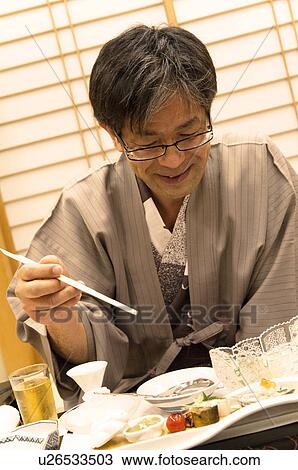 Mature Man Having Dinner View Large Photo Image Stock Image - Mature Man Having Dinner. Fotosearch