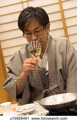 Mature Man Having White Wine with Dinner View Large Photo Image Stock Image - Mature Man Having White Wine with Dinner. Fotosearch