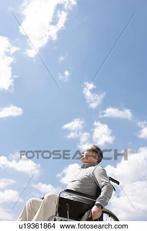 Picture - Mature Man in Wheelchair. Fotosearch