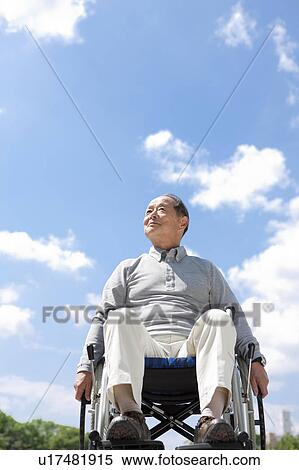 Stock Photography - Mature Man in Wheelchair. Fotosearch