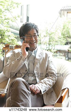 Mature Man on Mobile Phone View Large Photo Image Stock Photo - Mature Man on Mobile Phone. Fotosearch