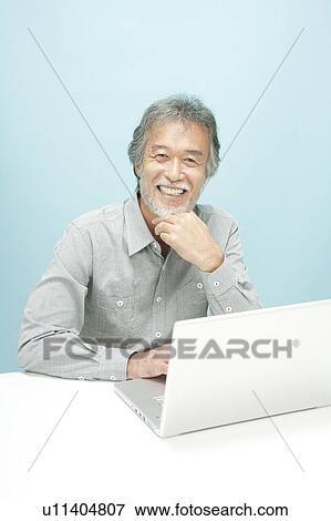 Mature Man Using Laptop View Large Photo Image Stock Photo - Mature Man Using Laptop. Fotosearch