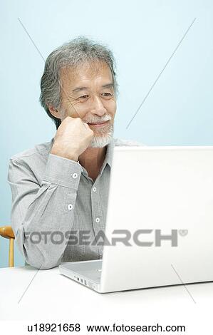 Mature Man Using Laptop View Large Photo Image Stock Photo - Mature Man Using Laptop. Fotosearch