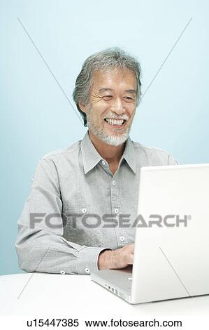 Mature Man Using Laptop View Large Photo Image Stock Photography - Mature Man Using Laptop. Fotosearch