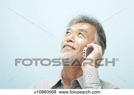 Mature Man Using Mobile Phone View Large Photo Image Stock Photo - Mature Man Using Mobile Phone. Fotosearch