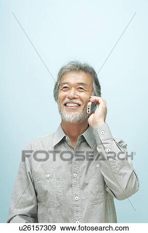 Stock Photo - Mature Man Using Mobile Phone. Fotosearch