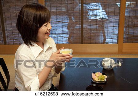 Mature Woman Enjoying Tea and Sweets View Large Photo Image Stock Photo - Mature Woman Enjoying Tea and Sweets. Fotosearch