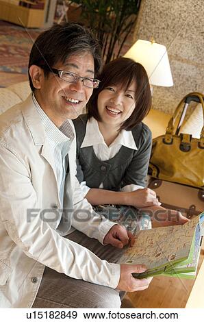 Middle-aged Couple with Map View Large Photo Image Stock Photo - Middle-aged Couple with Map. Fotosearch