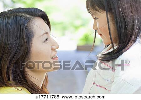 Mother and Daughter Looking At Each Other View Large Photo Image Stock Photography - Mother and Daughter Looking At Each Other. Fotosearch