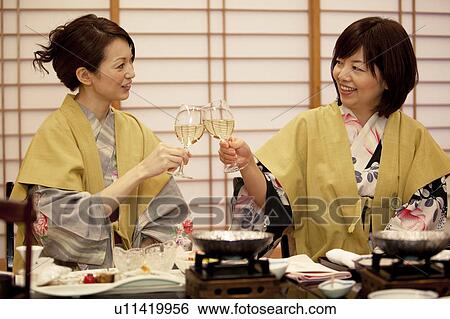 Mother and Daughter Toasting with White Wine View Large Photo Image Stock Photograph - Mother and Daughter Toasting with White Wine. Fotosearch