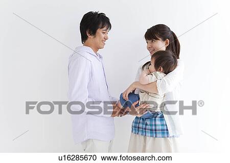 Stock Image - Mother, Father and Baby Boy. Fotosearch