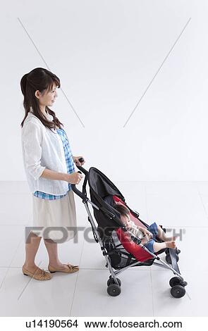 Mother Pushing Buggy with Baby Boy View Large Photo Image Picture - Mother Pushing Buggy with Baby Boy. Fotosearch