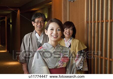 Stock Photo - Parents and Adult Daughter Wearing Yukatas. Fotosearch