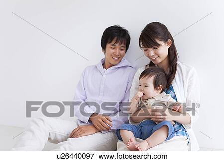 Stock Photo - Parents and Baby Boy. Fotosearch