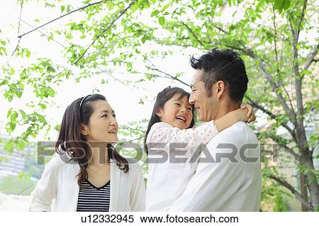 Parents and Daughter in Park View Large Photo Image Stock Photography - Parents and Daughter in Park. Fotosearch