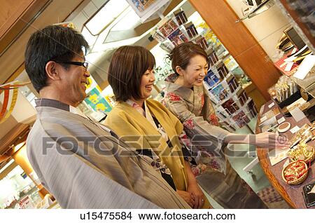 Picture - Parents and Their Adult Daughter in Gift Spring. Fotosearch