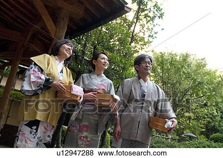 Stock Photo - Parents and Their Adult Daughter in Spa. Fotosearch