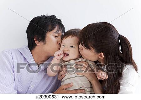 Parents Kissing Baby Boy's Cheeks View Large Photo Image Stock Image - Parents Kissing Baby Boy's Cheeks. Fotosearch