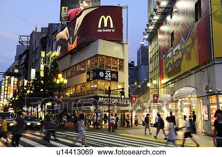 Stock Photo - Pedestrians Crossing Outside Seibu-Shinjuku Station. Fotosearch