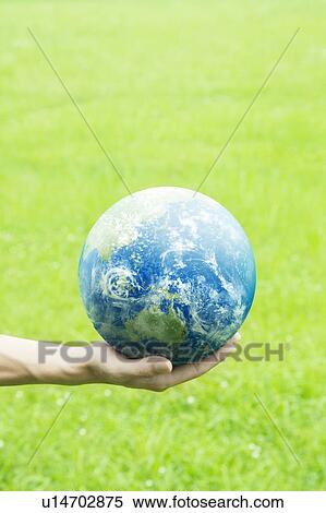 Stock Photography - Person Holding Globe. Fotosearch
