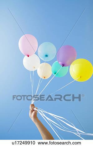Person Holding Up Balloons View Large Photo Image Stock Image - Person Holding Up Balloons. Fotosearch
