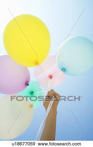 Person Holding Up Balloons View Large Photo Image Stock Photo - Person Holding Up Balloons. Fotosearch