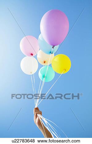 Person Holding Up Balloons View Large Photo Image Stock Photo - Person Holding Up Balloons. Fotosearch