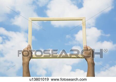 Person Holding Up Picture Frame View Large Photo Image Stock Photo - Person Holding Up Picture Frame. Fotosearch