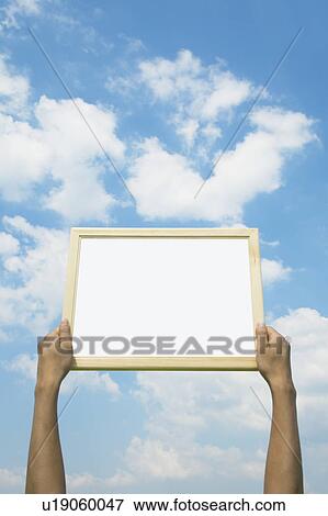 Person Holding Up Picture Frame View Large Photo Image Stock Photo - Person Holding Up Picture Frame. Fotosearch