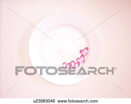 Stock Photograph - Pink Heart Shaped Sweets on Plate. Fotosearch