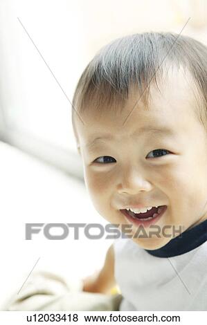 Stock Photo - Portrait of Cheerful Baby Boy. Fotosearch