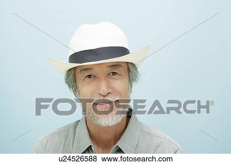 Stock Photo - Portrait of Mature Man Wearing Hat. Fotosearch