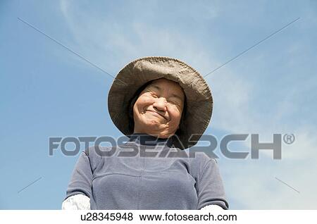 Stock Photo - Portrait of Senior Female Farmer. Fotosearch