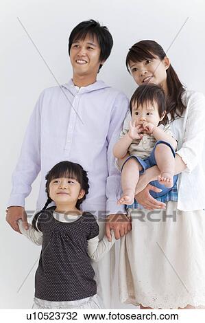 Stock Image - Portrait of Young Family. Fotosearch