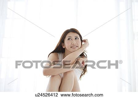 Portrait of Young Woman Against White Background View Large Photo Image Stock Image - Portrait of Young Woman Against White Background. Fotosearch