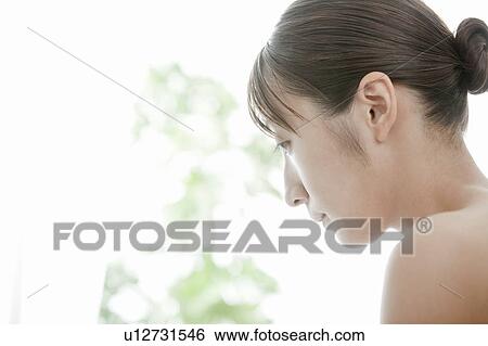 Profile of young woman View Large Photo Image Stock Photograph - Profile of young woman . Fotosearch