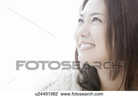 Stock Image - Profile of young woman, Tokyo Prefecture, Honshu, Japan. Fotosearch
