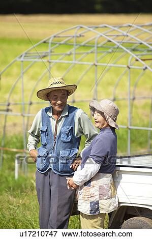 Stock Photo - Senior Farmer Couple in Field. Fotosearch
