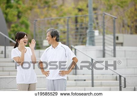 Stock Photo - Sporty Mature Couple Talking. Fotosearch