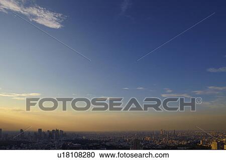 Stock Image - Sunset Over Shinjuku and Ikebukuo, Seen From Roppongi. Fotosearch