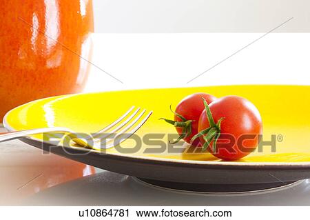 Stock Image - Tomatoes and Fork on Plate. Fotosearch