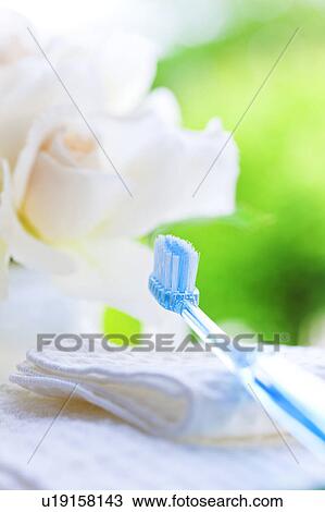Stock Image - Toothbrush and towel. Fotosearch