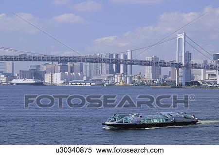 Stock Photography - Tourboat in Tokyo Bay, Skyline in Background. Fotosearch