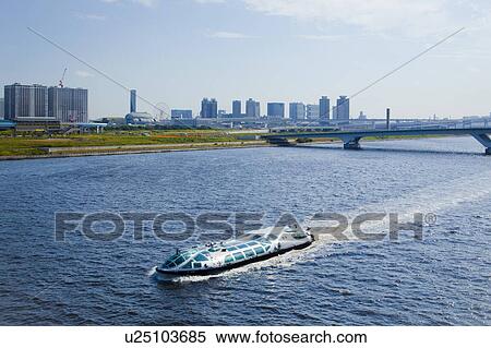 Stock Photography - Toyosu Ohashi and Tourboat Seen From Harumi Bridge. Fotosearch