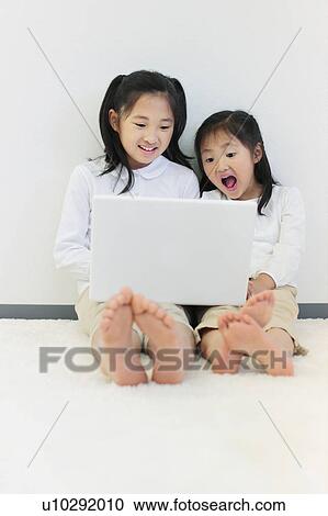 Two Girls Sitting on Floor View Large Photo Image Stock Image - Two Girls Sitting on Floor. Fotosearch