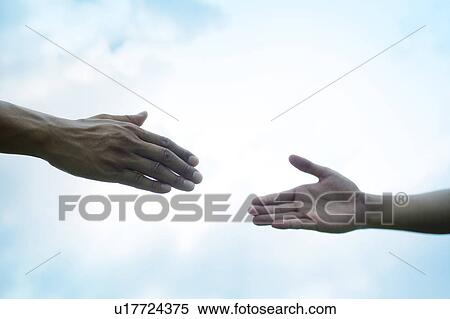 Two People Reaching For Each Other View Large Photo Image Stock Photography - Two People Reaching For Each Other. Fotosearch