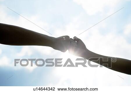 Two People With Fists Together View Large Photo Image Stock Image - Two People With Fists Together. Fotosearch