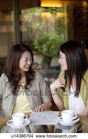 Two Young Women Having Coffee View Large Photo Image Picture - Two Young Women Having Coffee. Fotosearch